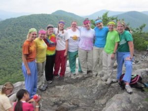 Camp leaders posing together at the top of a mountain peak called Pinnacle Knob in Clayton, Georgia.
